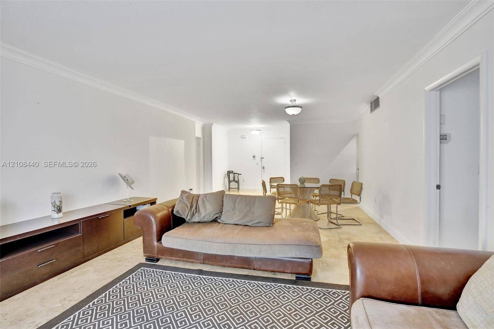 9801 Collins Avenue, #3T, Bal Harbour, Bal Harbour, FL 33154 Neutral-toned stone flooring, crown molding, and recessed ceiling lighting throughout