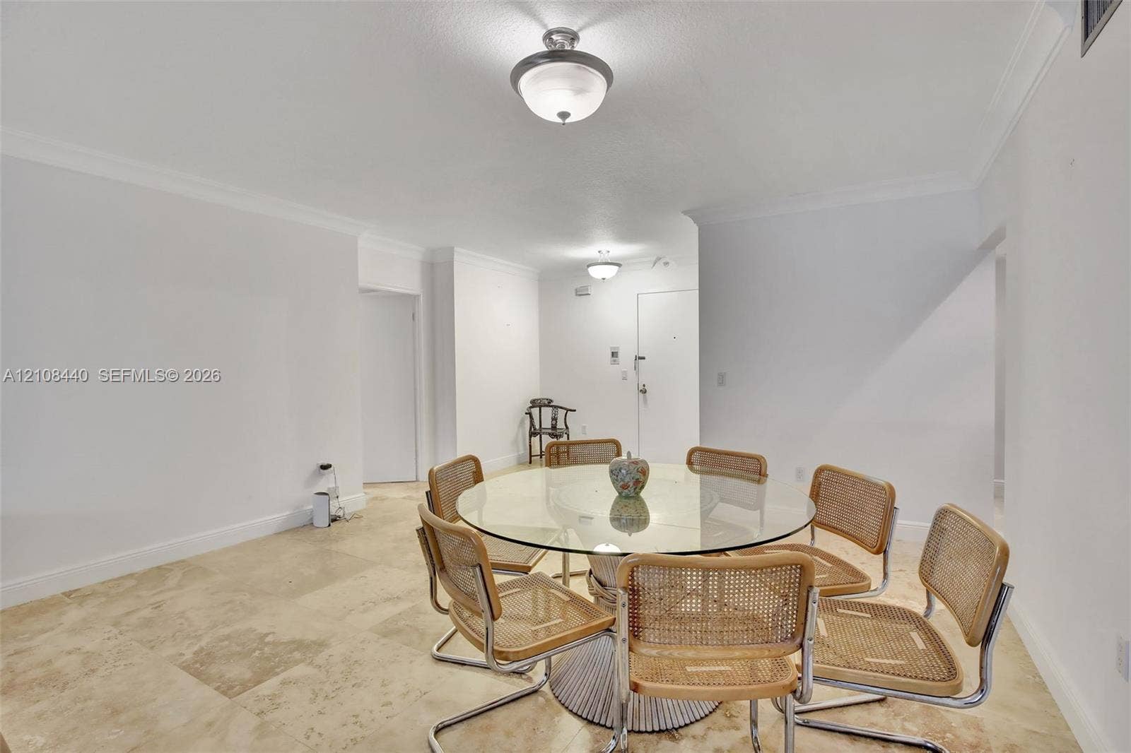 9801 Collins Avenue, #3T, Bal Harbour, Bal Harbour, FL 33154 Neutral-toned natural stone flooring, crisp white walls, crown molding, and dual semi-flush mount light fixtures