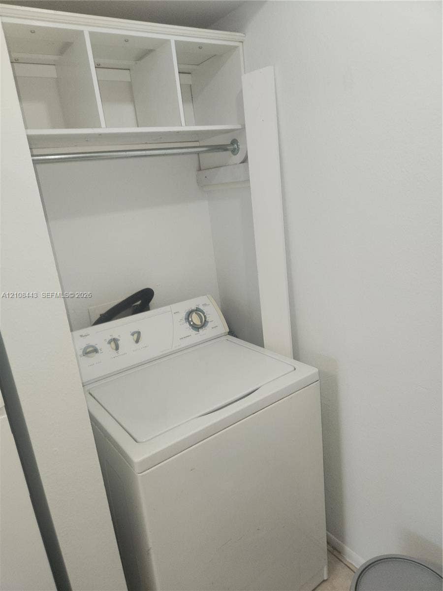4018 NW 87th Avenue, #4018, Sunrise, Sunrise, FL 33351 Built-in overhead shelving with an integrated metal clothing rod