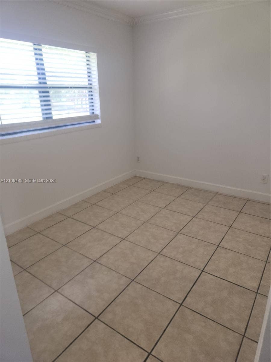 4018 NW 87th Avenue, #4018, Sunrise, Sunrise, FL 33351 Neutral-toned ceramic tile flooring, crisp white interior paint, and a multi-pane window featuring installed horizontal blinds