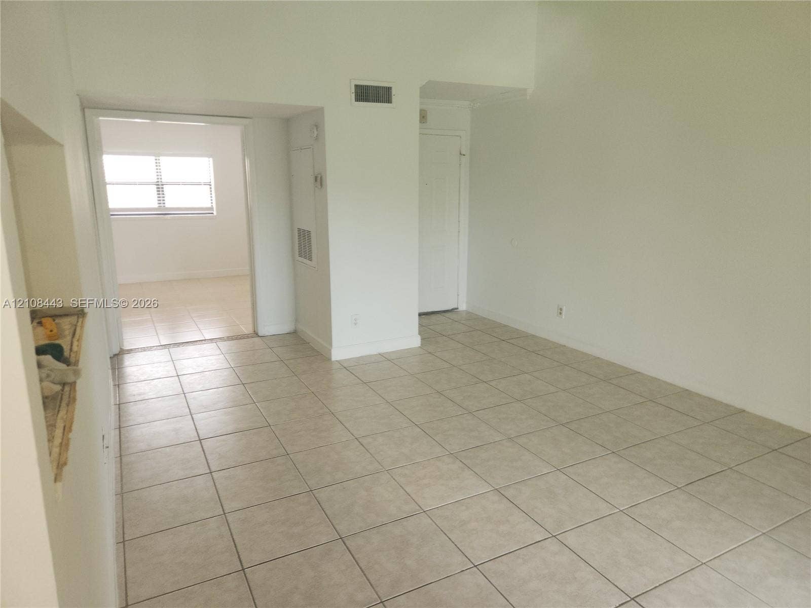 4018 NW 87th Avenue, #4018, Sunrise, Sunrise, FL 33351 Neutral tile flooring, expansive wall space, and multiple interior openings with white-finish trim