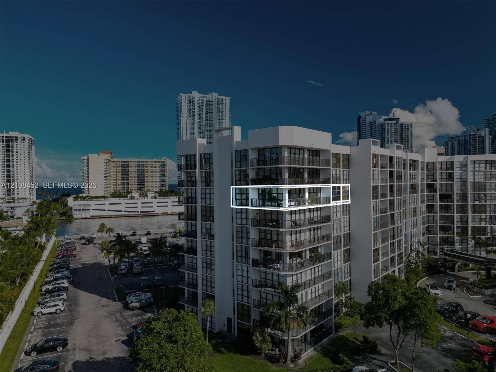 1000 Parkview Drive, #809, Hallandale Beach, FL 33009 High-rise unit featuring a private balcony, floor-to-ceiling glass windows, and aluminum railing