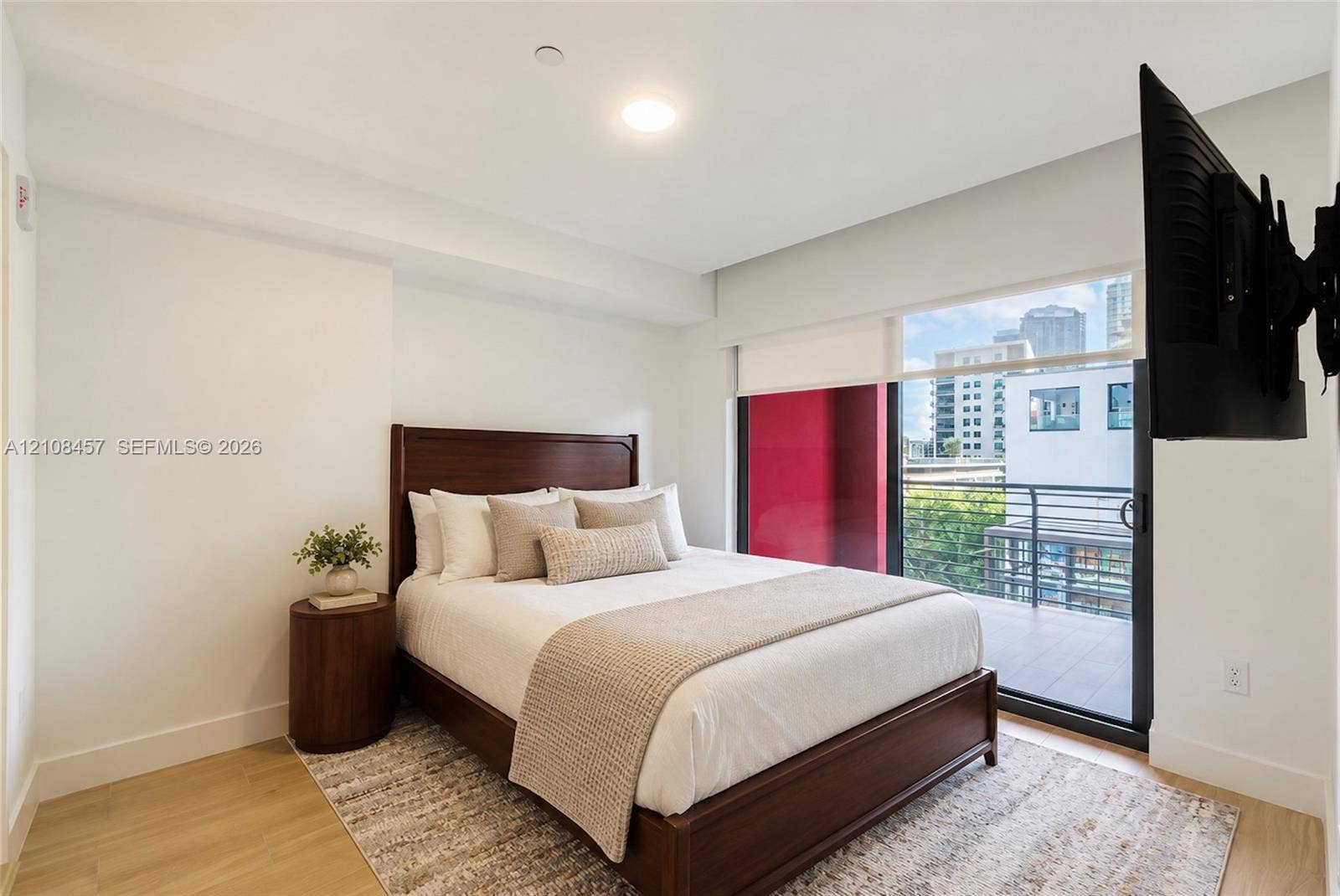 90 NE 32nd Street, #511, Miami, FL 33127 Bedroom featuring wood-finish flooring, recessed lighting, and a sliding glass door providing access to a private balcony