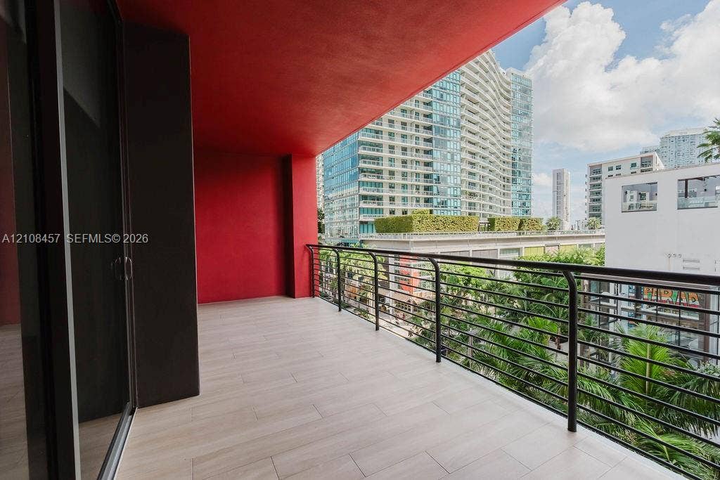 90 NE 32nd Street, #511, Miami, FL 33127 Covered balcony featuring tile flooring and a horizontal rail system