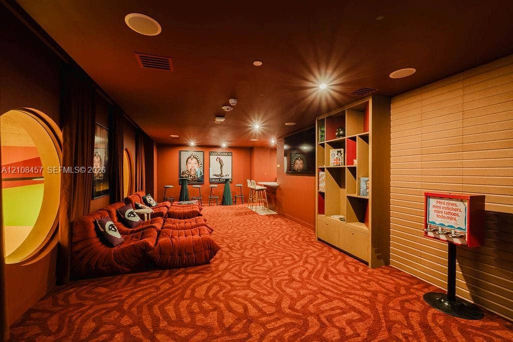 90 NE 32nd Street, #511, Miami, FL 33127 Custom built-in shelving, circular architectural wall cutouts, recessed ceiling lighting, and a built-in counter area