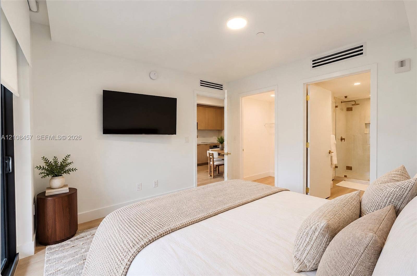 90 NE 32nd Street, #511, Miami, FL 33127 Recessed ceiling lighting, light-toned wood-finish flooring, and minimalist white interior wall finish