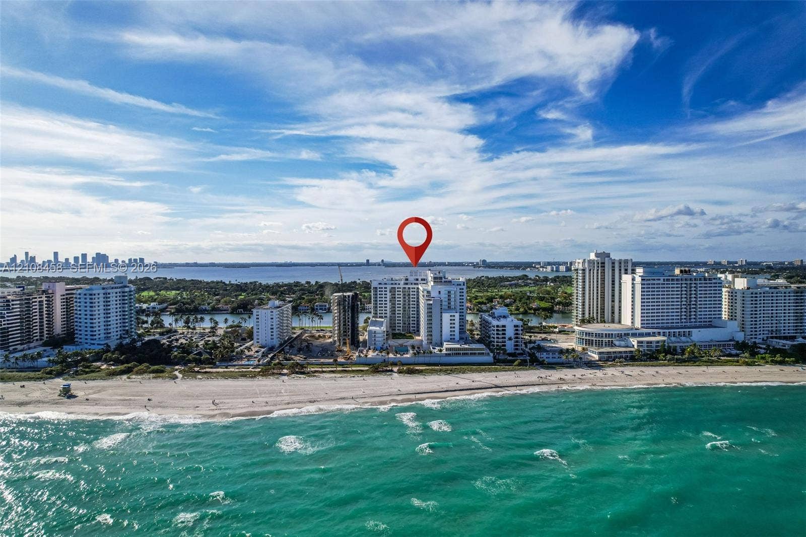 High-rise residential building situated on the Atlantic coastline featuring direct beach access and proximity to regional waterways