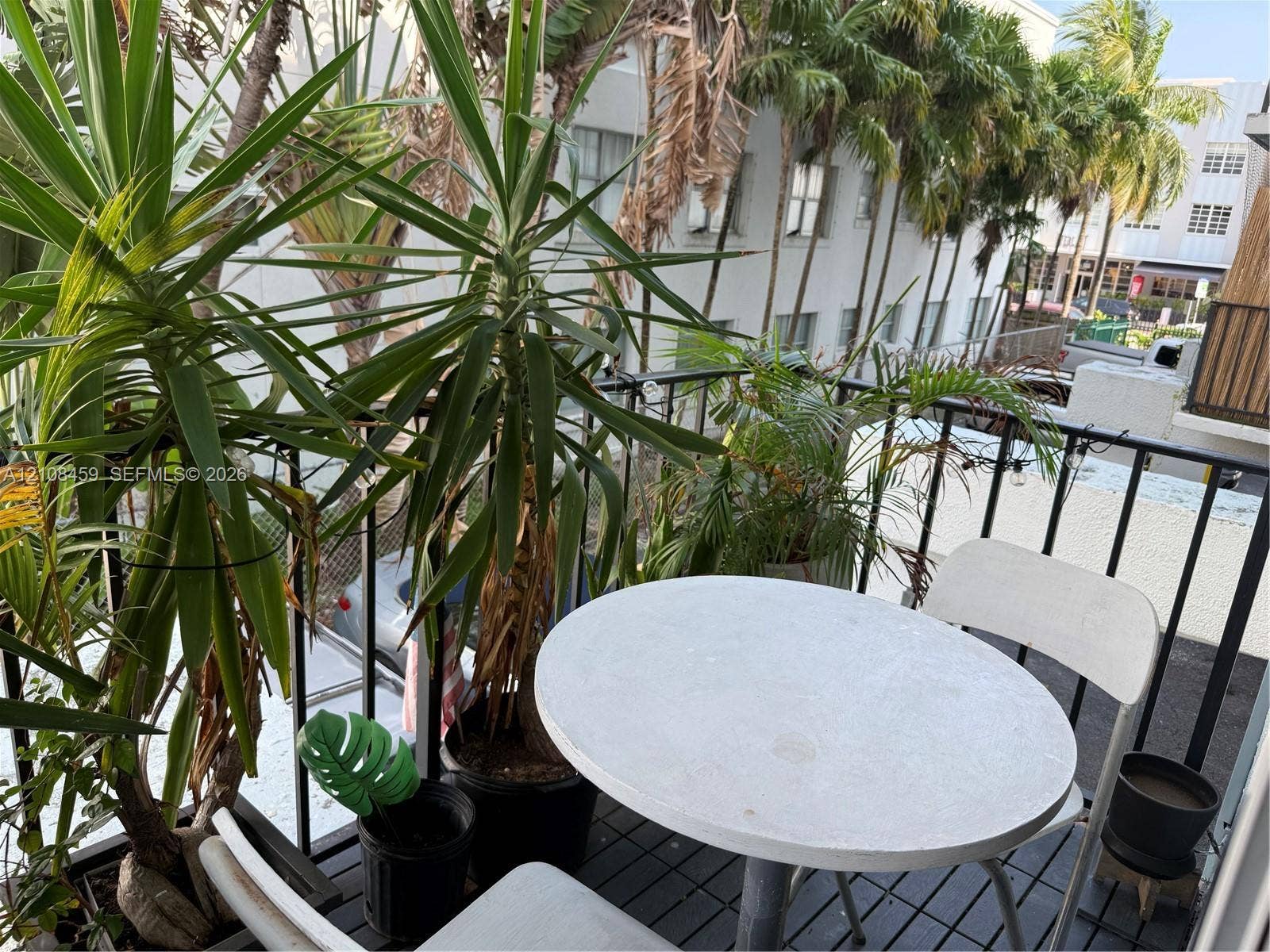 720 Collins Avenue, #206, Miami Beach, Miami Beach, FL 33139 Outdoor balcony featuring black metal railings and slat-style flooring
