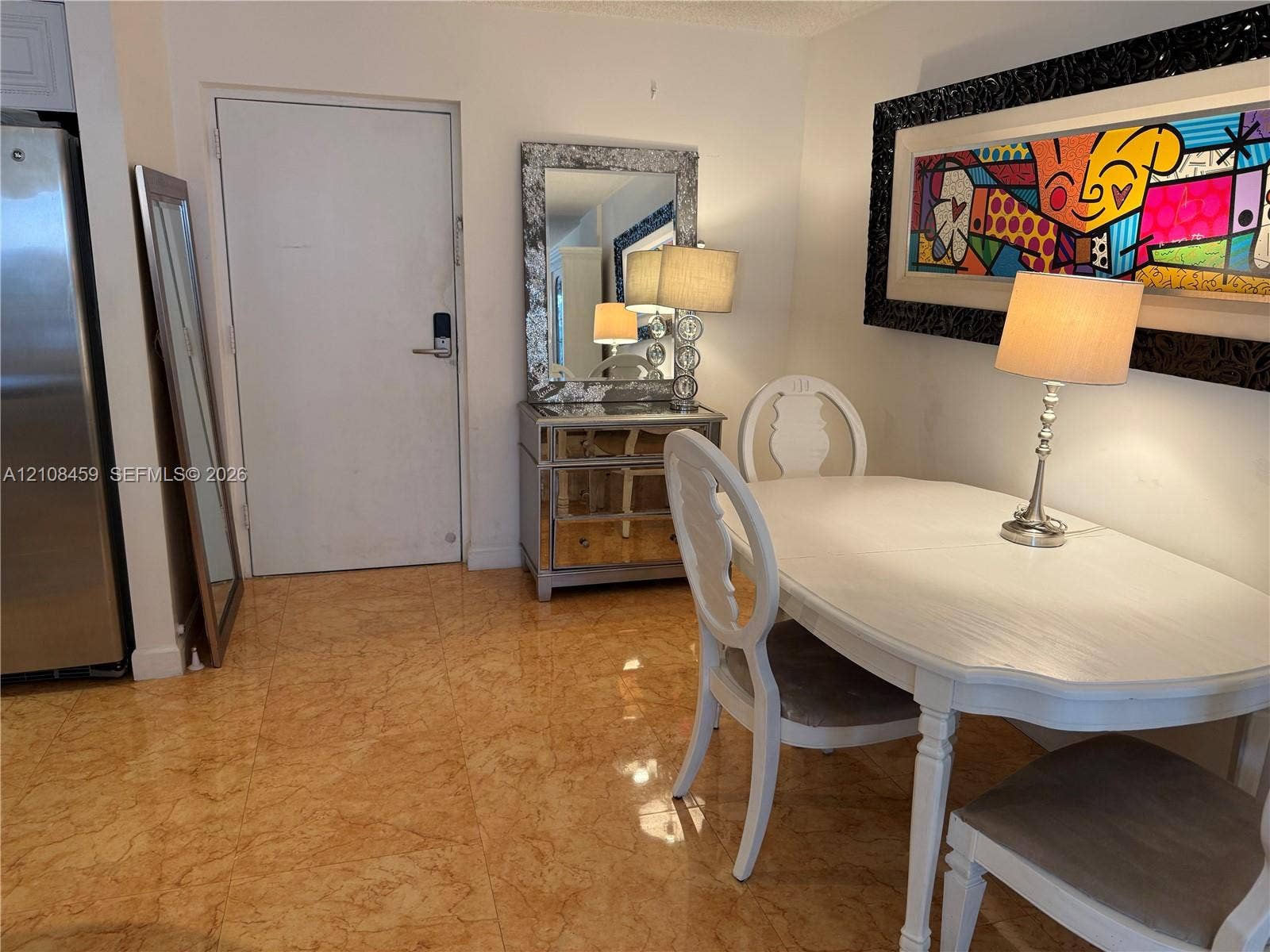 720 Collins Avenue, #206, Miami Beach, Miami Beach, FL 33139 Polished stone flooring throughout the area and a high-contrast decorative wall accent