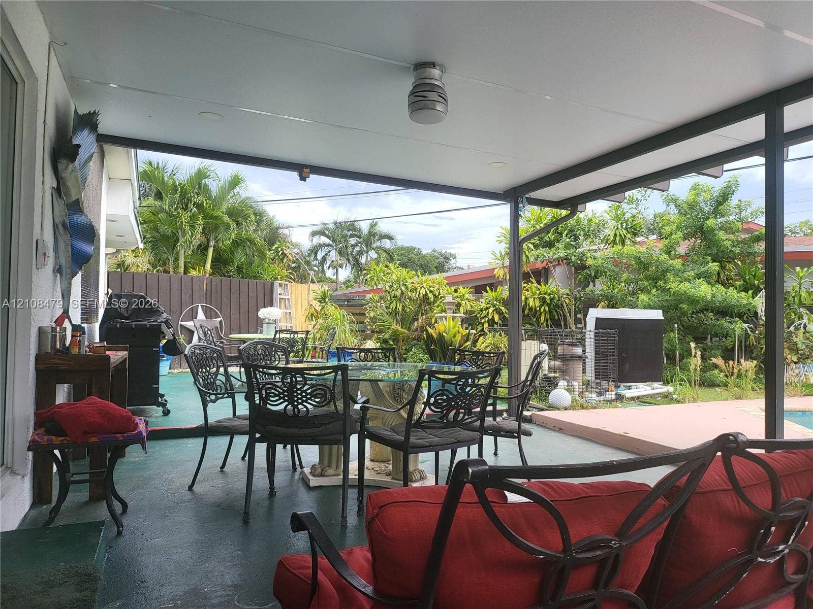 Covered patio featuring a solid-surface ceiling, recessed lighting, and metal framing