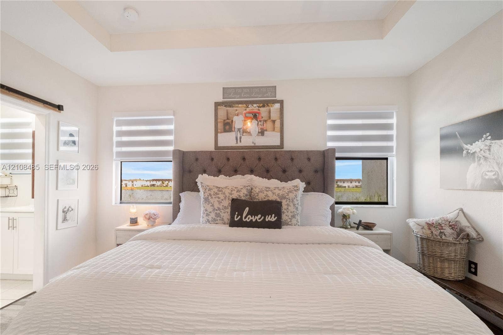 10217 SW 231st Lane, Miami, FL 33190 Tray ceiling, dual windows with integrated cellular shades, and sliding barn door hardware