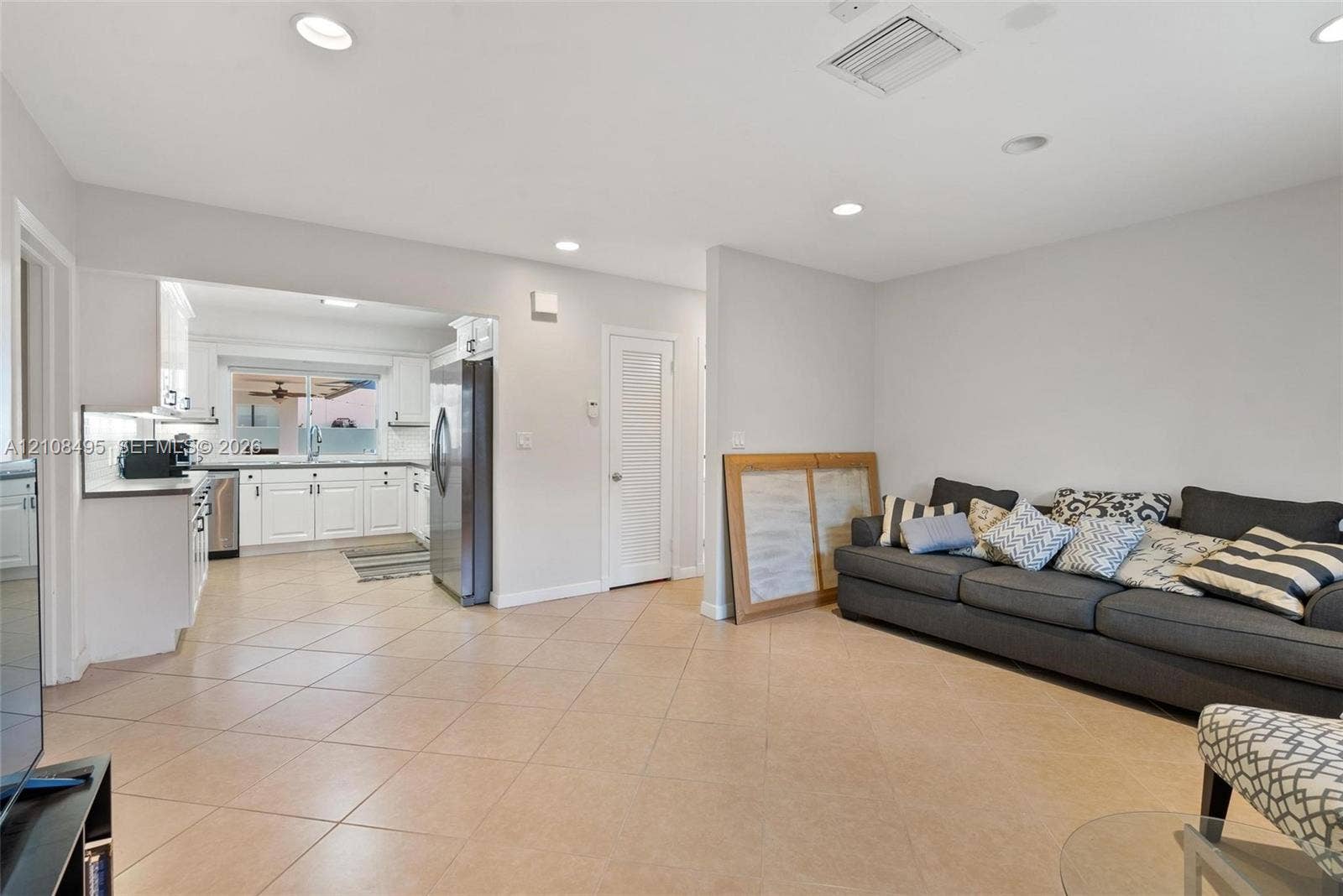 3080 NE 43rd Street, Fort Lauderdale, FL 33308 Open-concept area featuring neutral wall tones, recessed lighting, and tile flooring throughout