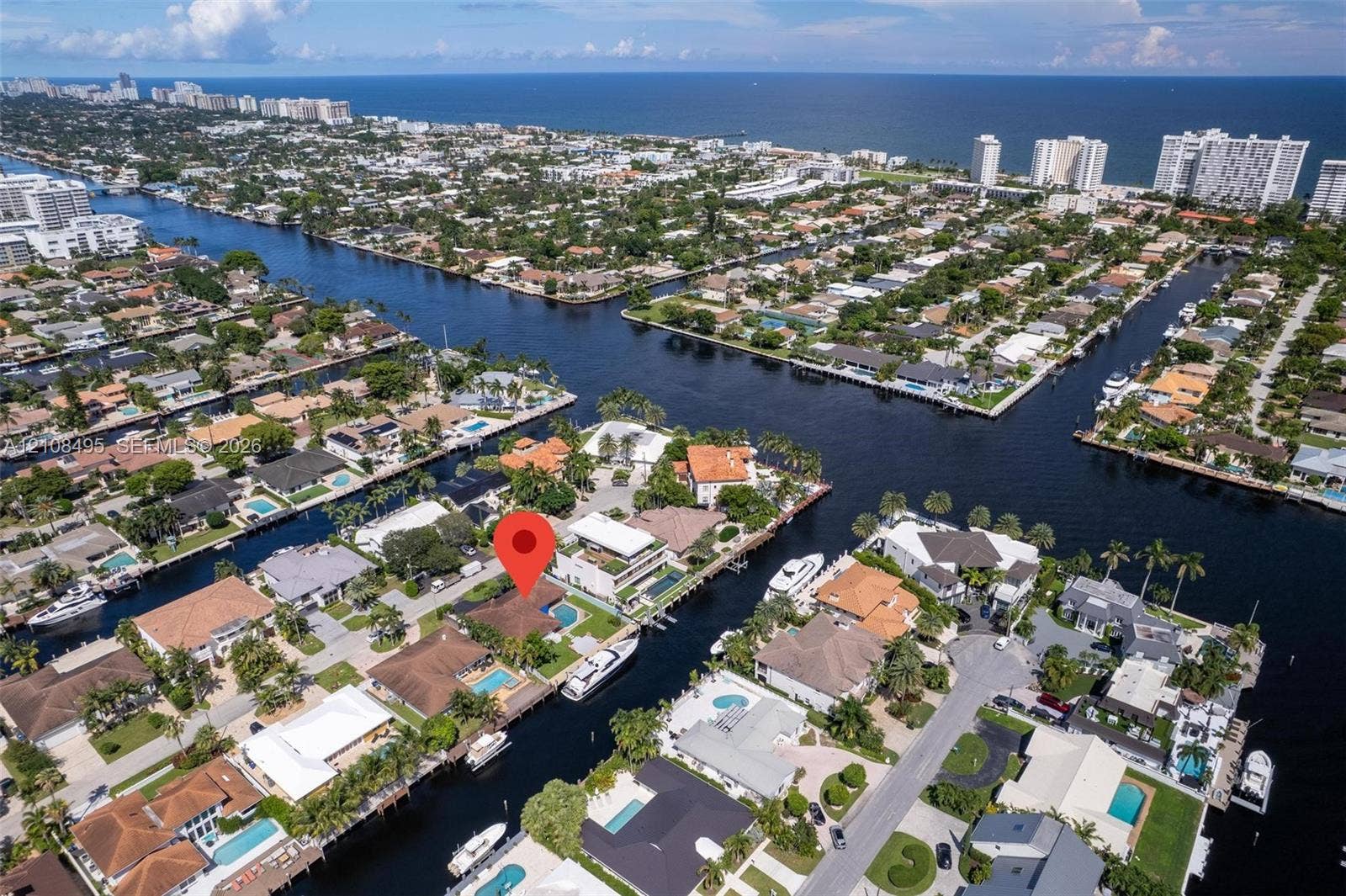3080 NE 43rd Street, Fort Lauderdale, FL 33308 Waterfront property featuring deep-water canal frontage, private boat dockage, and a swimming pool