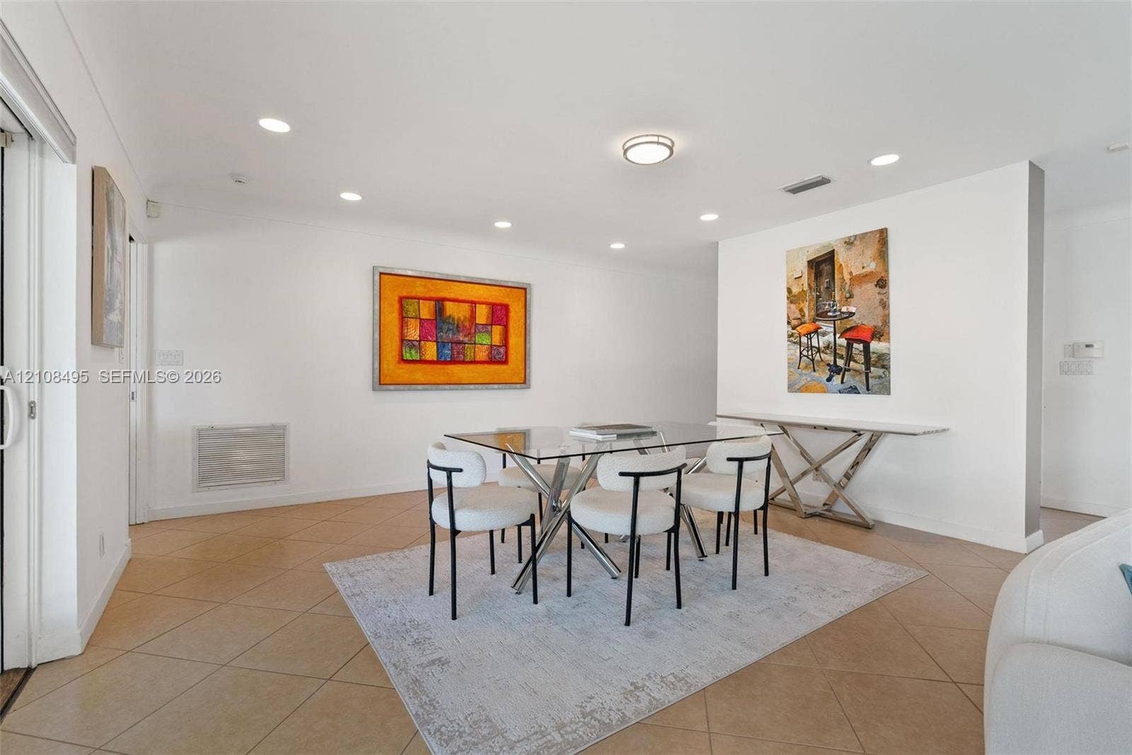 3080 NE 43rd Street, Fort Lauderdale, FL 33308 Neutral-toned tile flooring, recessed lighting, and a low-profile flush-mount ceiling fixture