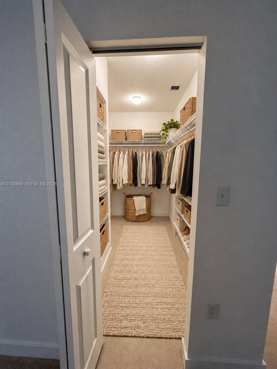 104 NW 31st Avenue, Fort Lauderdale, FL 33311 Walk-in storage space featuring built-in shelving, wire racking, and a flush-mount ceiling light