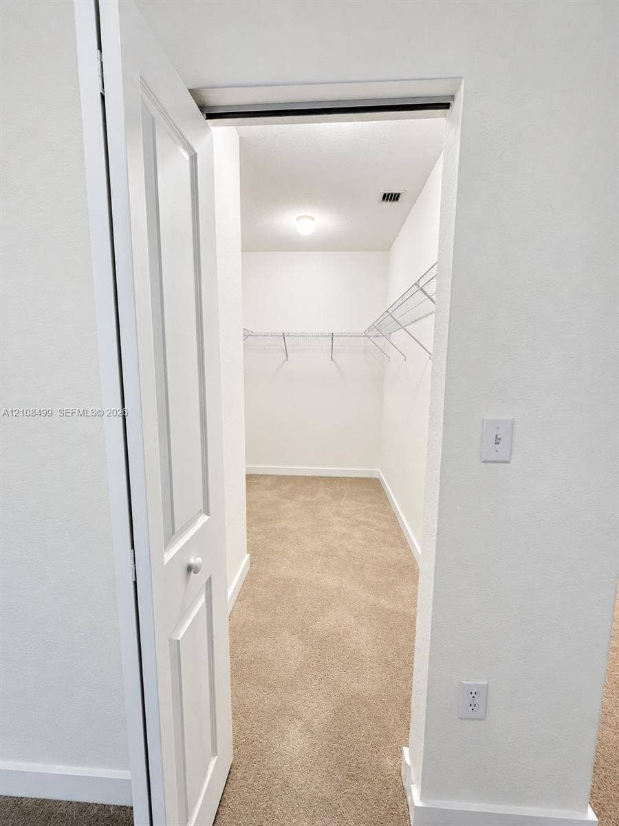 104 NW 31st Avenue, Fort Lauderdale, FL 33311 Walk-in storage space featuring wall-to-wall carpeting and integrated wire shelving