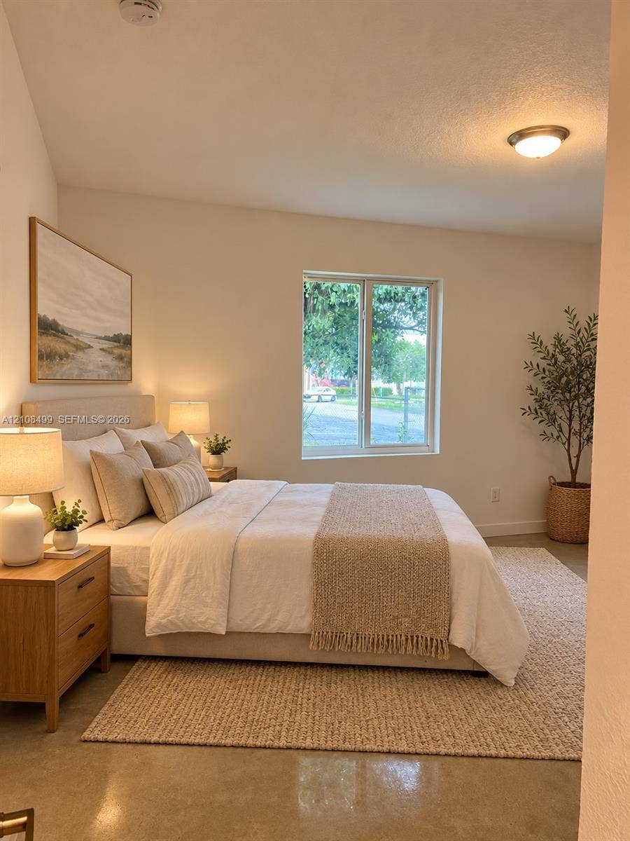 104 NW 31st Avenue, Fort Lauderdale, FL 33311 Vaulted ceiling, neutral wall tones, single-pane window, and polished concrete flooring