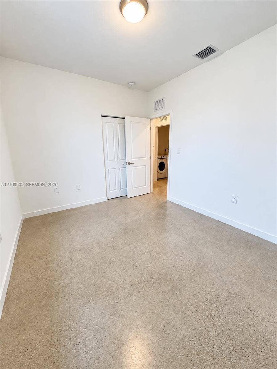 104 NW 31st Avenue, Fort Lauderdale, FL 33311 Polished concrete flooring, recessed ceiling lighting, and a multi-panel interior door