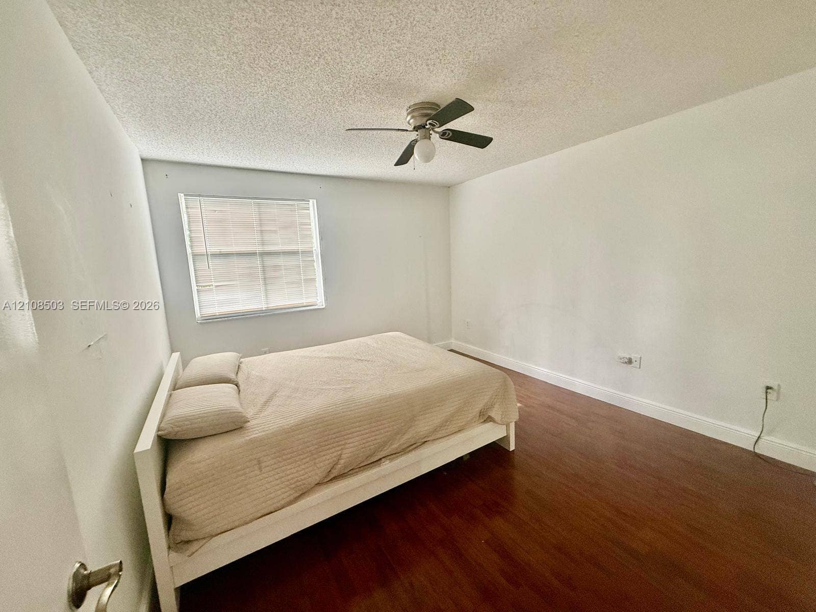 4872 NW 97th Place, #289, Doral, Doral, FL 33178 Room featuring wood-finish flooring, a ceiling fan with integrated lighting, and a window with horizontal blinds