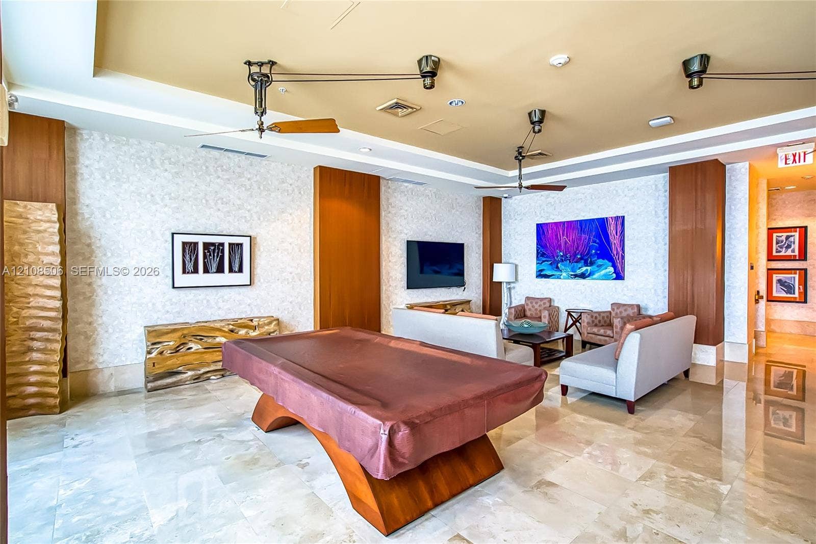 Polished stone flooring, textured wall treatments, wood-finish paneling, and ceiling-mounted industrial-style hardware