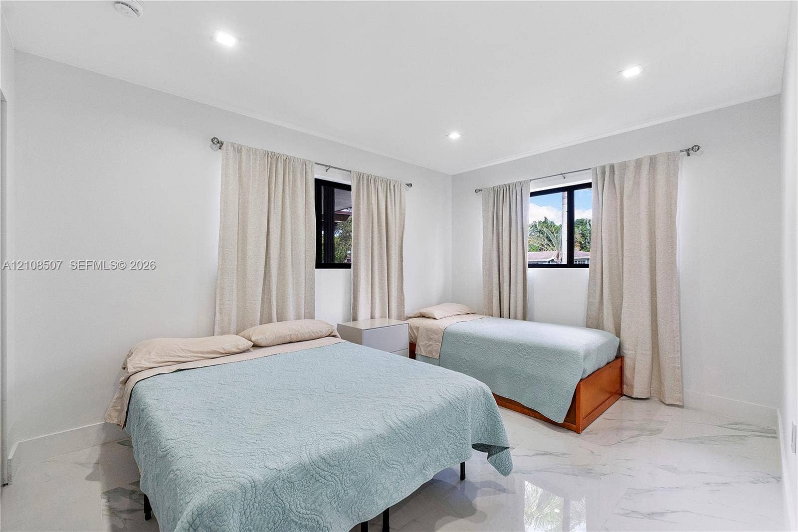 451 SW 38th Terrace, #1, Fort Lauderdale, Fort Lauderdale, FL 33312 Neutral wall tones, polished stone-finish flooring, recessed ceiling lighting, and black-framed windows