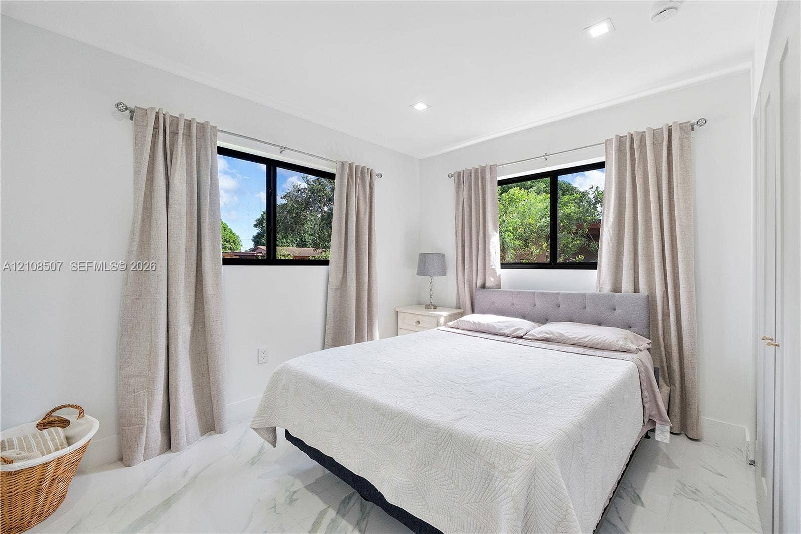 451 SW 38th Terrace, #1, Fort Lauderdale, Fort Lauderdale, FL 33312 Neutral-toned interior featuring recessed lighting, polished stone-finish flooring, and black-framed windows