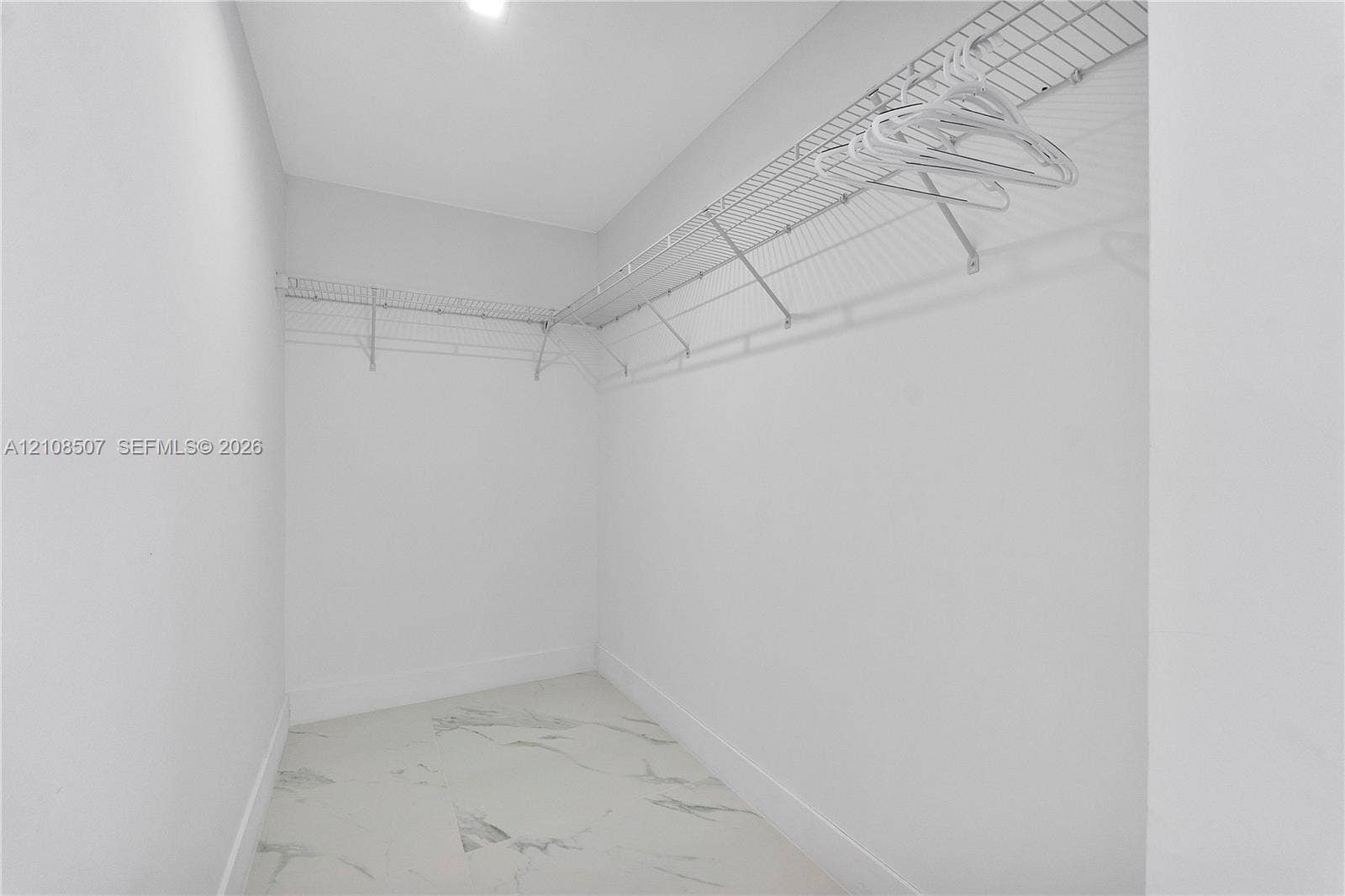 451 SW 38th Terrace, #1, Fort Lauderdale, Fort Lauderdale, FL 33312 Walk-in closet featuring stone-patterned tile flooring and wrap-around wire shelving