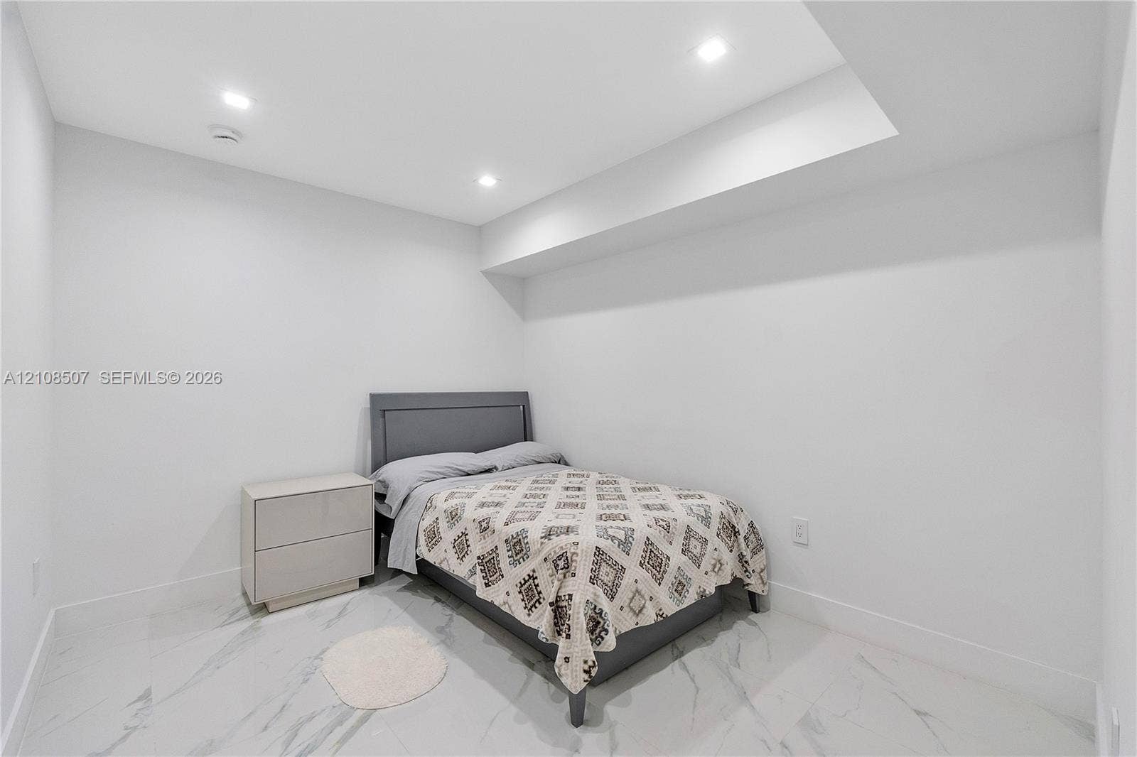 451 SW 38th Terrace, #1, Fort Lauderdale, Fort Lauderdale, FL 33312 Neutral-toned interior space featuring light-colored stone-finish tile flooring, recessed ceiling lighting, and a recessed ceiling architectural detail