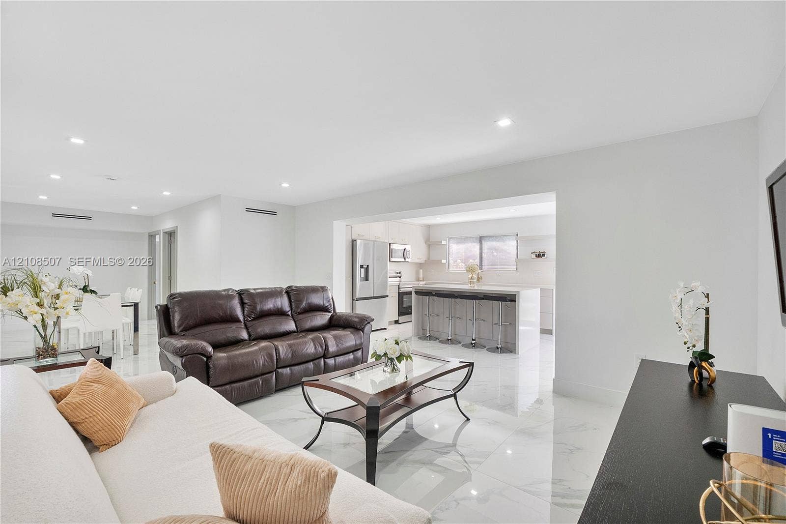 451 SW 38th Terrace, #1, Fort Lauderdale, Fort Lauderdale, FL 33312 Open floor plan featuring recessed lighting, polished stone-finish tile flooring, and a kitchen island with stone-finish countertop