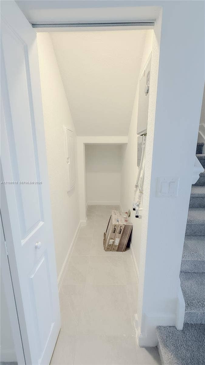 27733 SW 155th Court, #27733, Homestead, Homestead, FL 33032 Walk-in storage space with tile flooring, neutral walls, and a recessed ceiling design