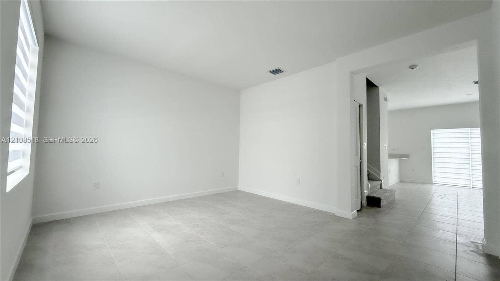 27733 SW 155th Court, #27733, Homestead, Homestead, FL 33032 Large-format tile flooring, neutral wall tones, and tiered window treatments featuring light-filtering shades