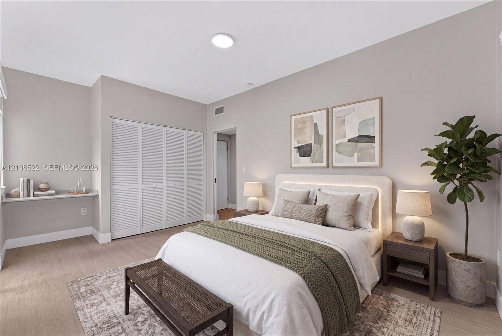 Neutral interior featuring wood-finish flooring, white louvered-door closet cabinetry, and a built-in wall-mounted shelf