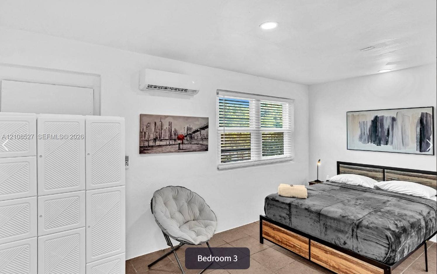 4549 SW 24th Avenue, Dania, Dania Beach, FL 33312 Neutral-tone interior featuring recessed lighting, tile flooring, and a wall-mounted climate control unit