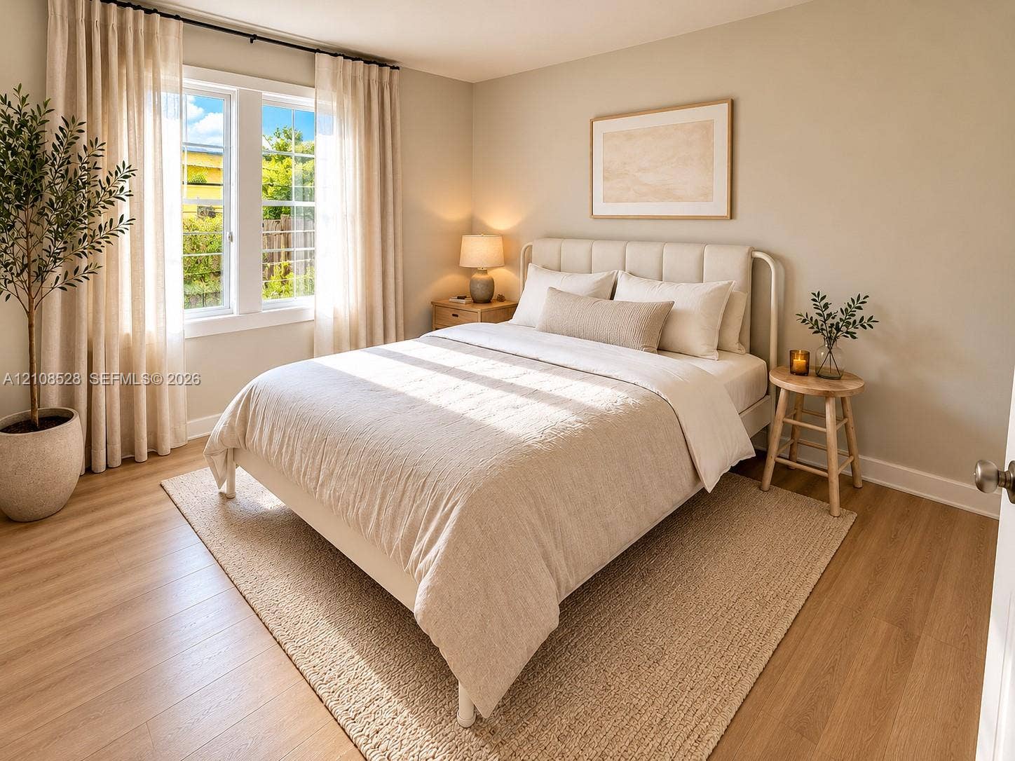 1124 N 18th Avenue N, Lake Worth, FL 33460 Bedroom featuring wood-finish flooring, neutral wall tones, and a dual-pane window
