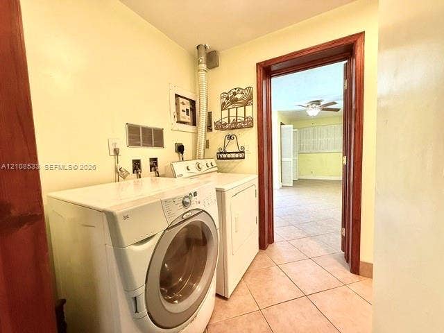 1124 NE 7th Street, Hallandale Beach, Hallandale Beach, FL 33009 Dedicated laundry space featuring ceramic tile flooring and wood-trim door casing