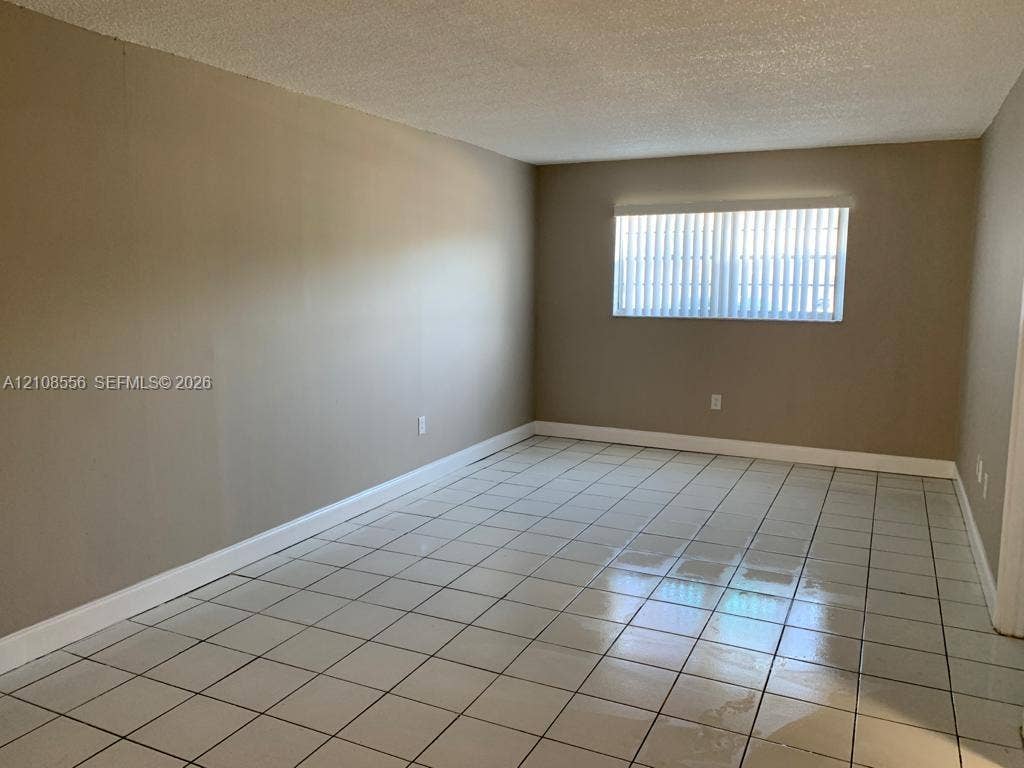 600 SW 2nd Avenue, #137, Boca Raton, FL 33432 Interior space featuring light-toned tile flooring and neutral wall paint