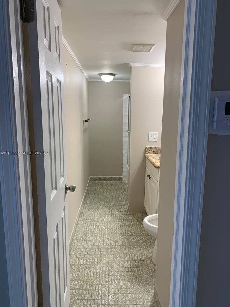 600 SW 2nd Avenue, #137, Boca Raton, FL 33432 Bathroom featuring tiled flooring, stone-finish countertop, white cabinetry, and flush-mount ceiling lighting