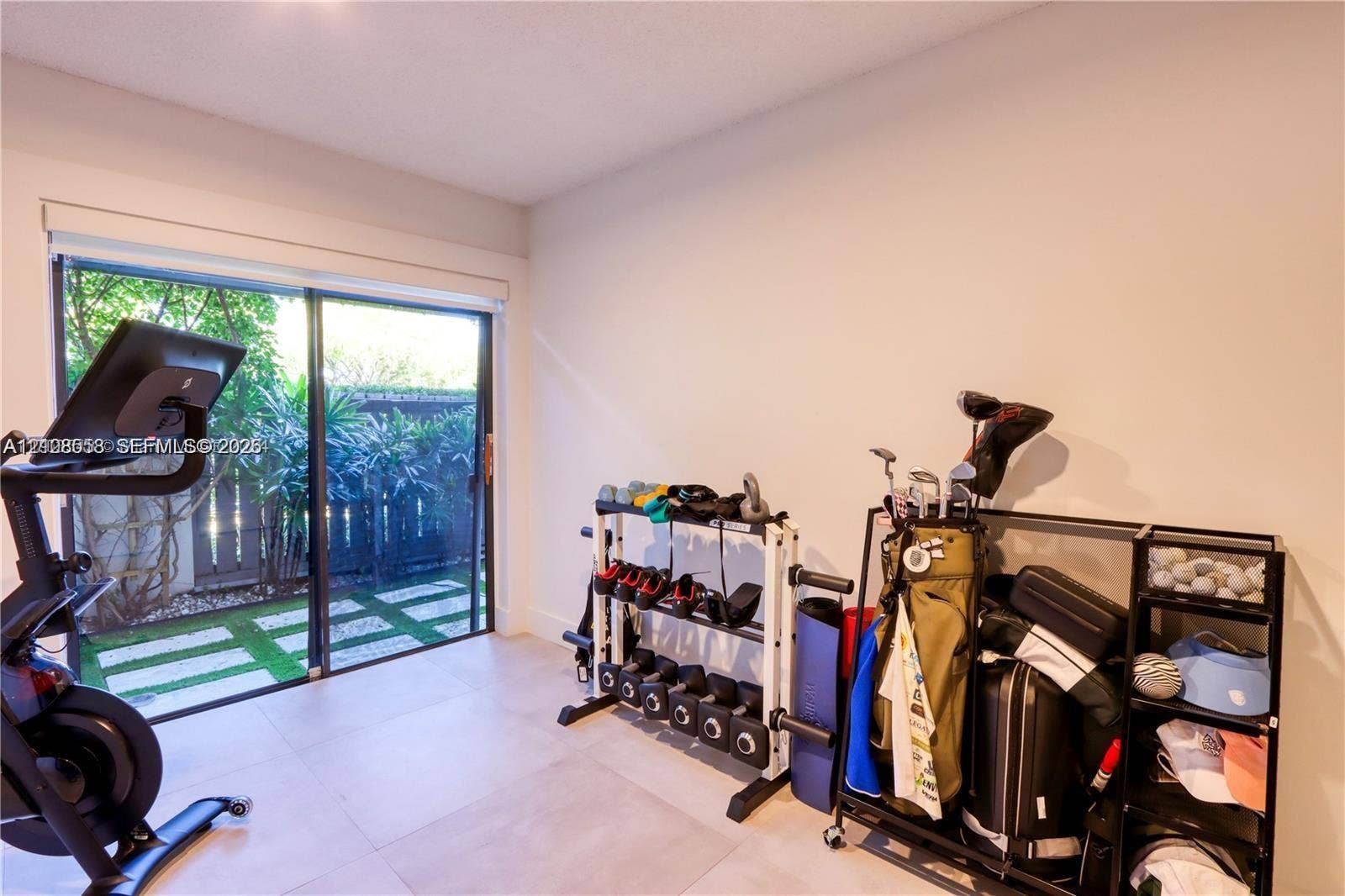 10478 SW 75th Lane, #10478, Miami, Miami, FL 33173 Large format tile flooring and sliding glass doors providing outdoor access