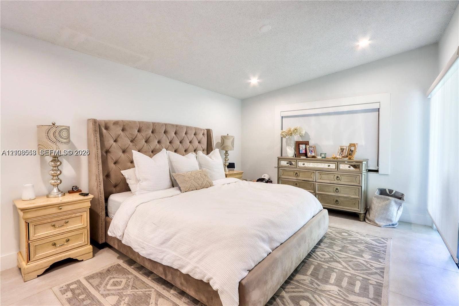 10478 SW 75th Lane, #10478, Miami, Miami, FL 33173 Spacious room featuring neutral tile flooring, recessed lighting, and large window with wide-slat blinds
