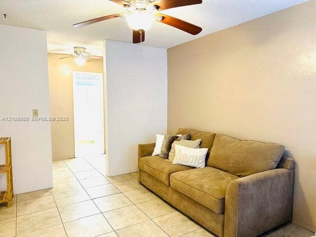 22 SE 3rd Terrace, #6, Dania, Dania Beach, FL 33004 Neutral wall finish, large-format ceramic tile flooring, and dual ceiling fans with integrated lighting fixtures