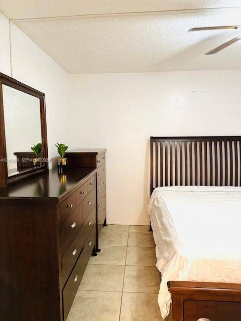 22 SE 3rd Terrace, #6, Dania, Dania Beach, FL 33004 Neutral-toned tile flooring and ceiling-mounted fan