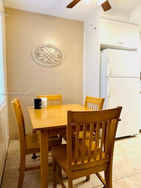 22 SE 3rd Terrace, #6, Dania, Dania Beach, FL 33004 Neutral-toned kitchen featuring ceramic tile flooring, ceiling-mounted paddle fan, and white cabinetry