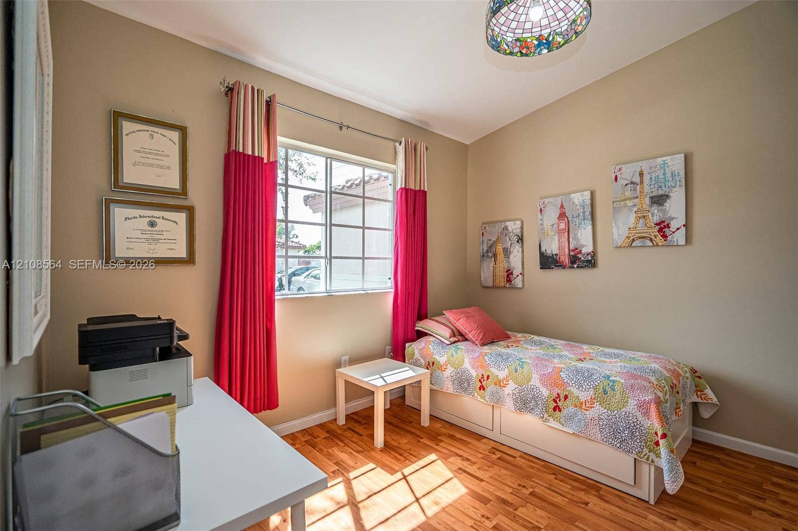 3111 NW 86th Avenue, Sunrise, FL 33351 Room featuring wood-finish flooring, a multi-pane window, and a stained-glass style pendant light fixture
