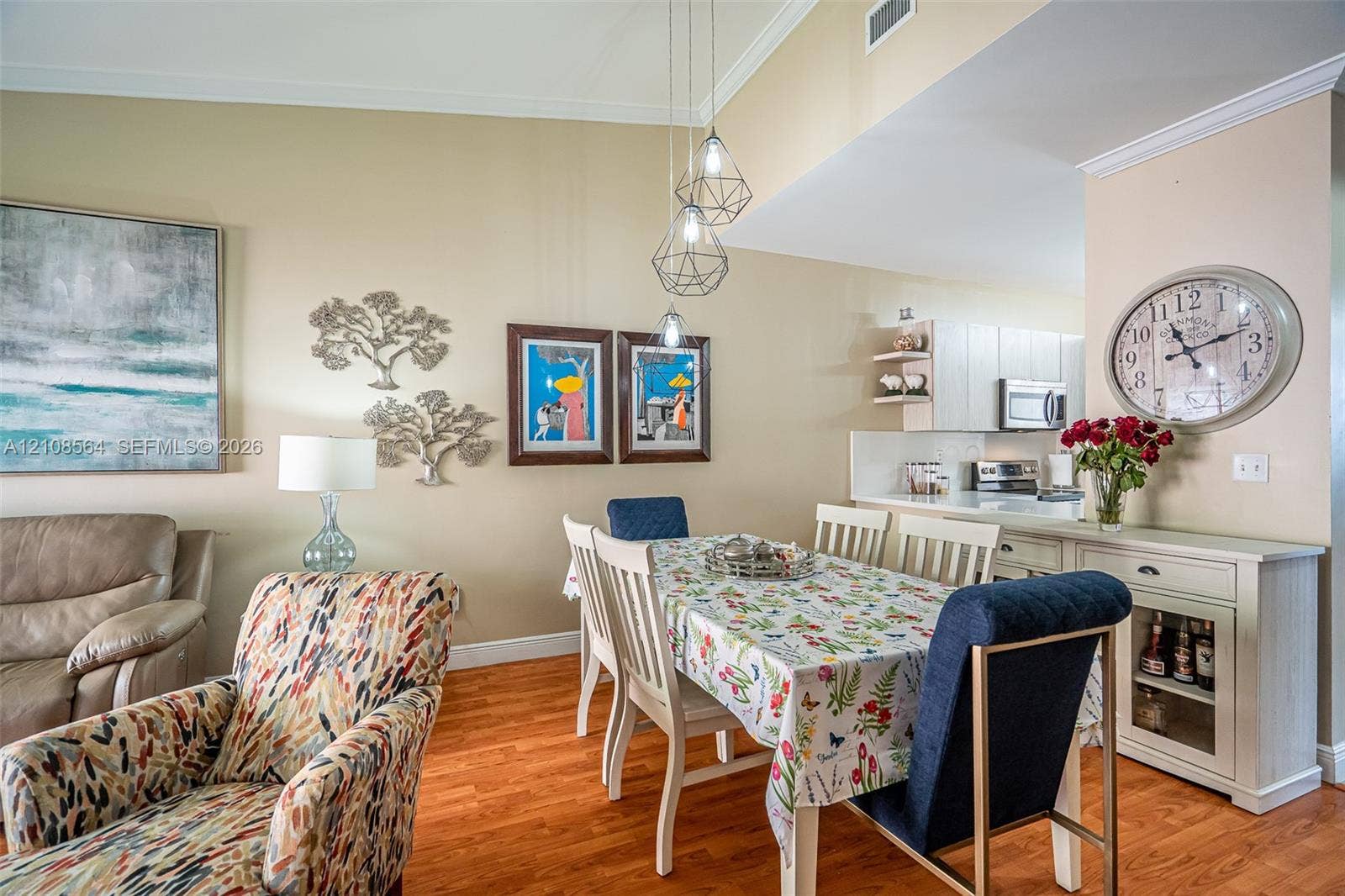 3111 NW 86th Avenue, Sunrise, FL 33351 Vaulted ceilings, wood-finish flooring, and geometric pendant lighting