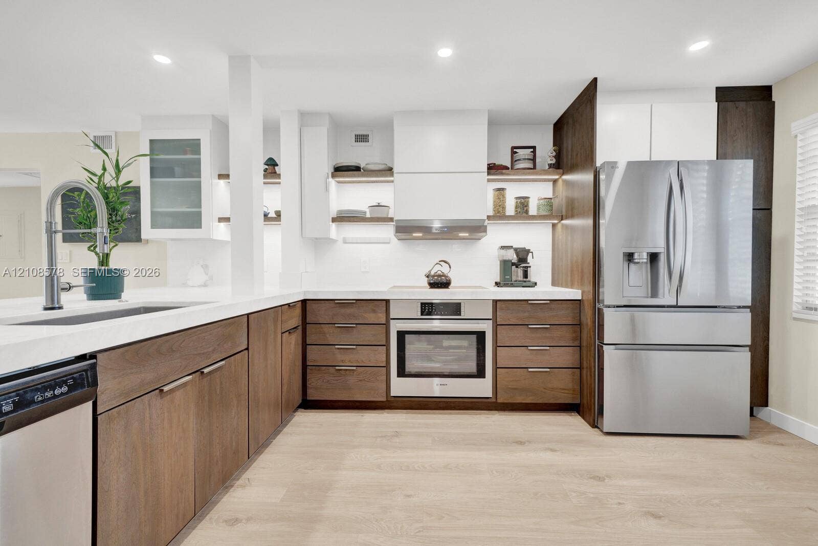 3005 Portofino Isle, #N2, Coconut Creek, Coconut Creek, FL 33066 Kitchen featuring wood-finish cabinetry, white countertops, recessed lighting, stainless steel appliances, and integrated open shelving
