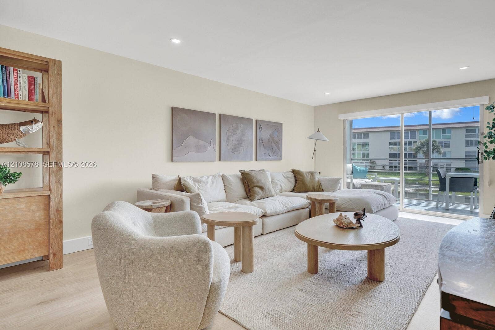 3005 Portofino Isle, #N2, Coconut Creek, Coconut Creek, FL 33066 Neutral wall palette featuring wood-finish flooring, recessed lighting, and large sliding glass doors providing outdoor access