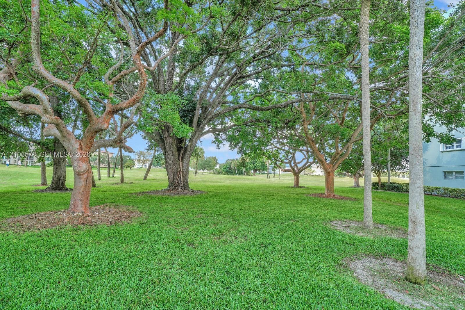 3005 Portofino Isle, #N2, Coconut Creek, Coconut Creek, FL 33066 Expansive grounds featuring mature shade trees, established landscaping, and open green space
