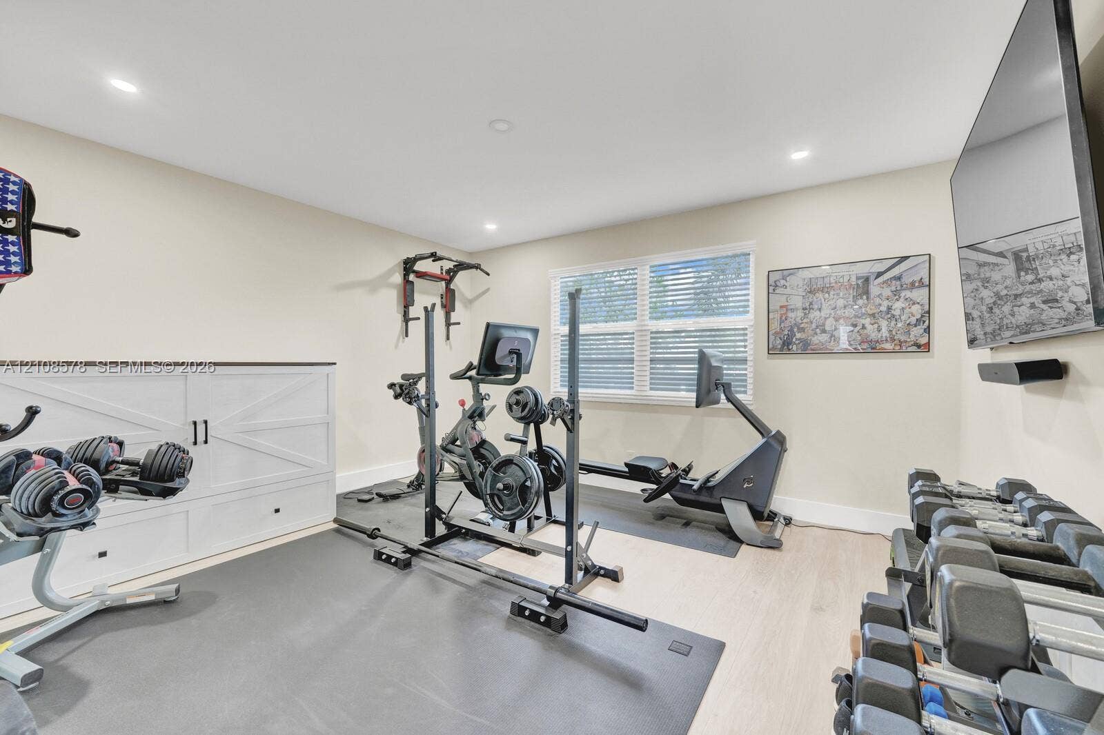 3005 Portofino Isle, #N2, Coconut Creek, Coconut Creek, FL 33066 Recessed lighting, wood-finish flooring, and custom white cabinetry with a horizontal X-pattern design