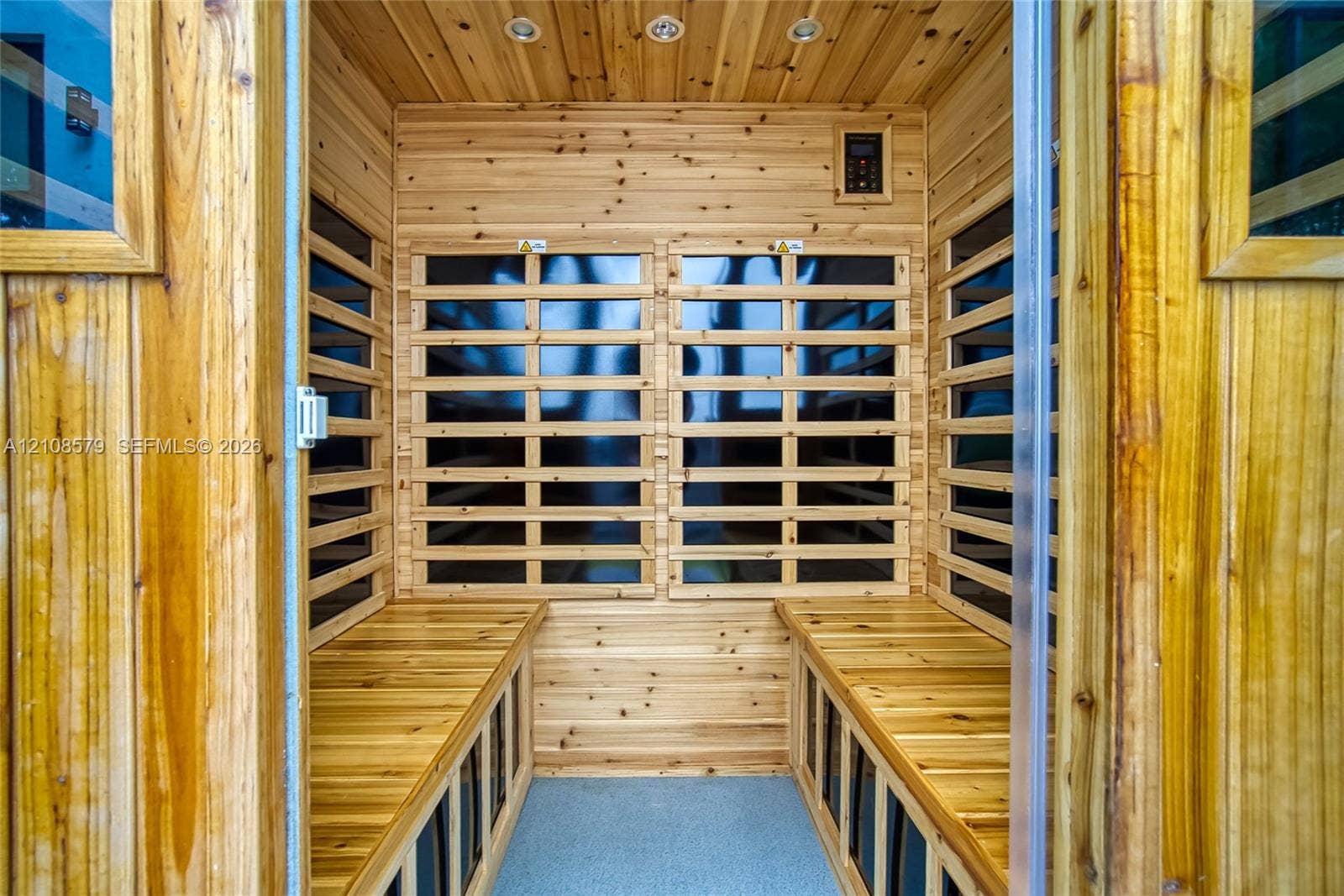 311 189th Street, #0, Sunny Isles Beach, Sunny Isles Beach, FL 33160 Sauna featuring tongue-and-groove wood paneling, integrated bench seating, built-in digital controls, and recessed ceiling lighting