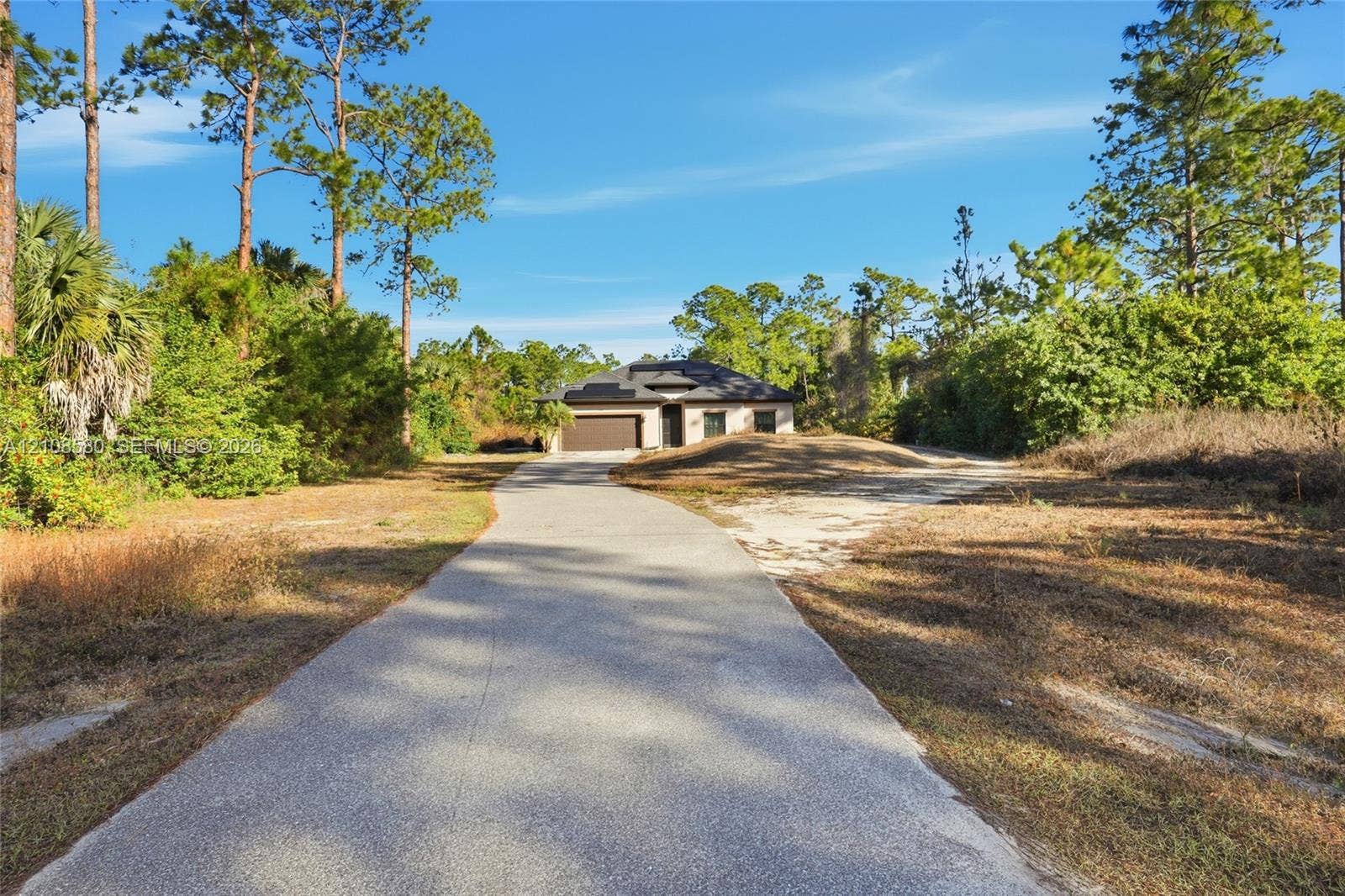 2363 NE 20 Th Avenue, Naples, FL 34120 Single-story residence.